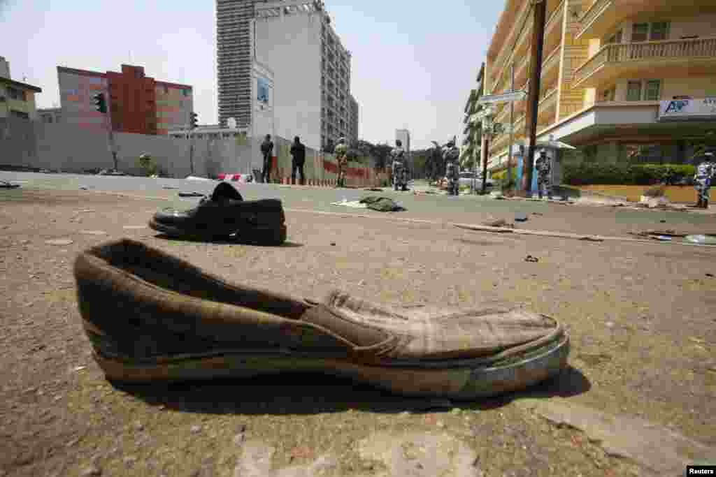 Shoes are seen along a street where a stampede occurred after a New Year's Eve fireworks display in Abidjan, Ivory Coast, January 1, 2013. 