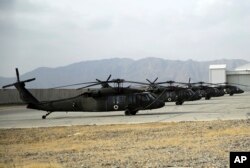 Blackhawk helicopters are on display during an air show at Kandahar Airfield, Afghanistan, Jan. 23, 2018.