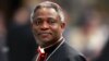 Cardinal Peter Kodwo Appiah Turkson of Ghana arrives to attend a mass led by bishop Leonardo Sandri of Argentina in St. Peter's Basilica at the Vatican April 13, 2005.