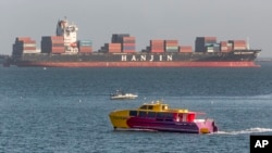 FILE - South Korea's Hanjin Shipping Co. container ship Hanjin Montevideo, top, is anchored outside the Port of Long Beach in Long Beach, Calif.