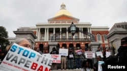 Demonstrators gather at the Massachusetts State House to protest against the state’s four-month ban of all vaping product sales in Boston, Oct. 3, 2019.