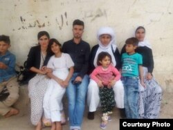 Dawood Saleh, a Yazidi from Sinjar who has resettled in the U.S., is pictured with his family in Sinjar before the Islamic State attack in 2014.