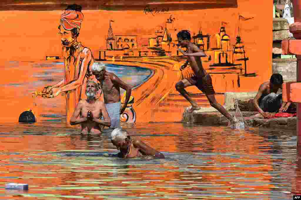 Hindu devotees bathe on the occasion of Akshaya Tritiya, a annual spring festival which is believed to bring good luck and success, in Narmada river in Jabalpur, India.