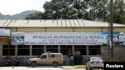 Members of security forces stand outside the 41 Brigada Blindada Fuerte Paramacay military base in Valencia, Venezuela, Aug. 6, 2017.