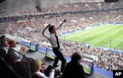 French President Emmanuel Macron reacts during the final match between France and Croatia at the 2018 soccer World Cup in the Luzhniki Stadium in Moscow, July 15, 2018.