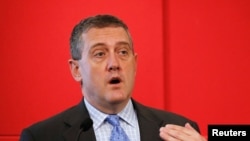 FILE - St. Louis Federal Reserve President James Bullard speaks at a public lecture in Singapore, May 26, 2016. 