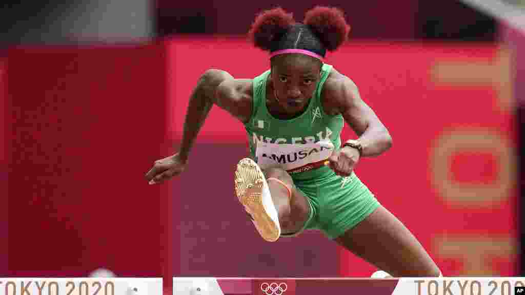 Tobi Amusan, of Nigeria, wins a heat in the women&#39;s 100-meter hurdles at the 2020 Summer Olympics, Saturday, July 31, 2021, in Tokyo. (AP Photo/Petr David Josek)