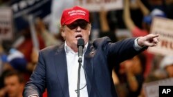 Republican presidential candidate Donald Trump speaks during a campaign rally Saturday, March 19, 2016, in Tucson, Arizona. 