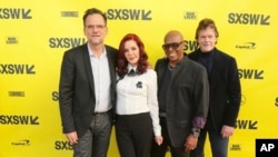FILE - Director Thom Zimny, from left, executive producer Priscilla Presley, David Porter and Jerry Schilling, arrive for the world premiere of "Elvis Presley: The Searcher" during the South by Southwest Film Festival at the Zach Theatre on Wednesday, March 14, 2018, in Austin, Texas.