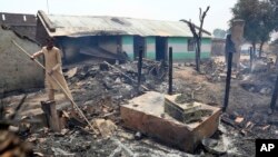 An Indian man inspects the damage after his home was gutted by firing allegedly from the Pakistan side of the border in Jora farm village, in Ranbir Singh Pura district of Jammu and Kashmir, India, May 22, 2018. 