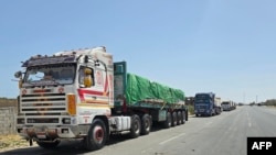 FILE—Egyptian trucks carrying humanitarian aid bound for the Gaza Strip wait near the Rafah border crossing on the Egyptian side on May 26, 2024, amid the ongoing conflict between Israel and Hamas.