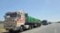 FILE—Egyptian trucks carrying humanitarian aid bound for the Gaza Strip wait near the Rafah border crossing on the Egyptian side on May 26, 2024, amid the ongoing conflict between Israel and Hamas.