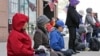 FILE - Practitioners of Falun Dafa, also called Falun Gong, meditate and exercise outside of the Chinese consulate, Thursday, April 25, 2019, in New York. Ping Li, 59, provided information to China about an individual affiliated with the Falun Gong movement.