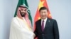 FILE - In this photo released by China's Xinhua News Agency, Chinese President Xi Jinping, right, shakes hands with Saudi Arabia's Crown Prince Mohammed bin Salman during a meeting on the sidelines of the G20 summit in Buenos Aires, Argentina, Nov. 30, 2018.