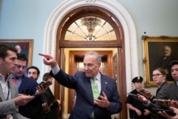 FILE - Senate Majority Leader Chuck Schumer of New York speaks to news reporters following the announcement of a bipartisan deal on infrastructure, on Capitol Hill in Washington, June 24, 2021.