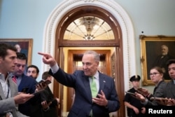 Senate Majority Leader Chuck Schumer (D-NY) speaks to news reporters following the announcement of a bipartisan deal on infrastructure, on Capitol Hill in Washington, June 24, 2021.