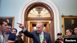 Senate Majority Leader Chuck Schumer (D-NY) speaks to news reporters following the announcement of a bipartisan deal on infrastructure, on Capitol Hill in Washington, June 24, 2021. 