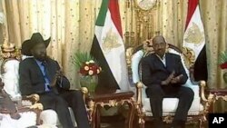 Sudanese President Omar Hassan al-Bashir and General Salva Kiir (L), first vice-president of Sudan and governor of Southern Sudan, is seen at the presidential palace in Khartoum in this video frame grab taken February 7, 2011.