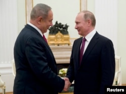 Russian President Vladimir Putin, right, shakes hands with Israeli Prime Minister Benjamin Netanyahu during a meeting in Moscow, March 9, 2017.