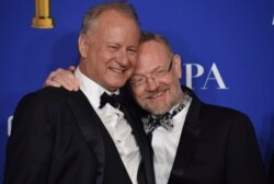 Stellan Skarsgard, left, and Jared Harris, from the cast of "Chernobyl," winners of the award for best television limited series or motion picture made for television, pose in the press room at the 77th annual Golden Globe Awards.