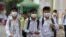 FILE: Students wear masks to avoid the contact of coronavirus at a high school in Phnom Penh, Cambodia, Tuesday, Jan. 28, 2020. (AP Photo/Heng Sinith) 