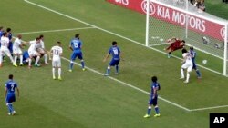 Uruguay's Diego Godin (3) scores his side's first goal during the group D World Cup soccer match between Italy and Uruguay at the Arena das Dunas in Natal, Brazil, Tuesday, June 24, 2014.