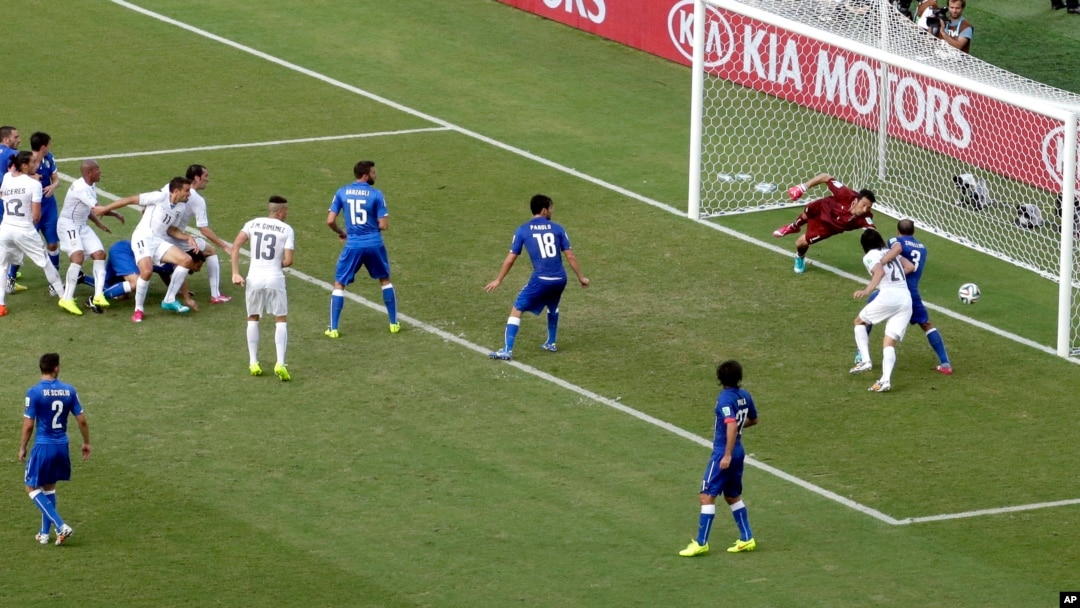 Uruguay's Diego Godin (3) scores his side's first goal during the group D World Cup soccer match between Italy and Uruguay at the Arena das Dunas in Natal, Brazil, Tuesday, June 24, 2014.