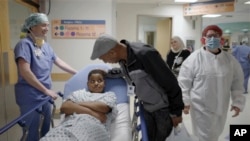 In this image from video provided by the Children’s Hospital of Philadelphia, an 11-year-old boy who was born with hereditary deafness prepares for a gene therapy procedure in Philadelphia in October 2023. (Children’s Hospital of Philadelphia via AP)