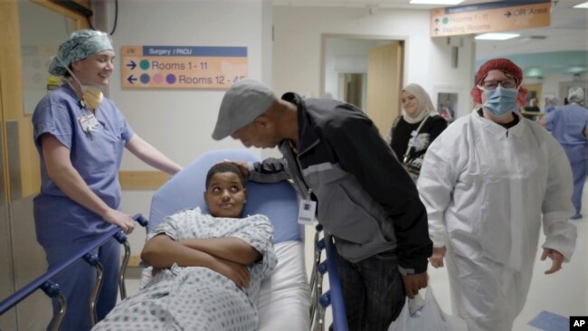 In this image from video provided by the Children’s Hospital of Philadelphia, an 11-year-old boy who was born with hereditary deafness prepares for a gene therapy procedure in Philadelphia in October 2023. (Children’s Hospital of Philadelphia via AP)