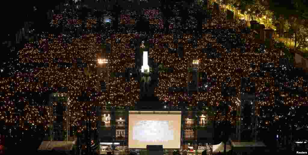 Thousands of people take part in a candlelight vigil to mark the 29th anniversary of the crackdown of pro-democracy movement at Beijing&#39;s Tiananmen Square in 1989, at Victoria Park in Hong Kong, China.