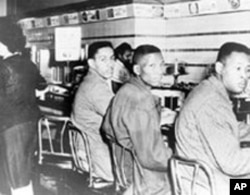 Four North Carolina A&T College students, including Ronald Martin (left) and Robert Patterson, were arrested for sitting at a Woolworth’s lunch counter in Greensboro, North Carolina, in 1960.