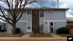 Television photographer interviews next door neighbor of Jamshid Muhtorov, Aurora, Colo., Jan. 23, 2012.