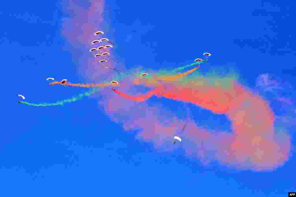 Members of Qatar&#39;s air sport committee perform during the Kuwait aviation show in Kuwait City.