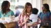 First lady Melania Trump holds a baby as she visits Greater Accra Regional Hospital in Accra, Ghana, Oct. 2, 2018. 