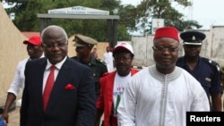 FILE - Sierra Leone's president Ernest Bai Koroma (L) and vice president Samuel Sam Sumana arrive at the National Electoral Commission in Freetown October 11, 2012. 