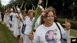Laura Pollan, leader the Cuban dissident group Ladies in White, protests after the group's weekly march in Havana, 7 Nov. 2010.