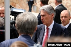 British Foreign Secretary Philip Hammond talks to reporters in Vienna, Austria, July 10, 2015.