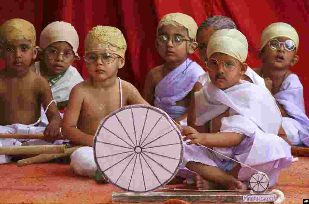Indian children dressed like Mahatma Gandhi assemble at an event during Gandhi Jayanti in Ajmer. Gandhi Jayanti is the birth anniversary of Gandhi, the father of the nation.