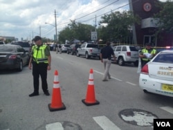 Police cordon off an area near the site of the shooting at the Pulse Club in Orlando, Florida, June 12, 2016. (J. Pernalete/VOA)