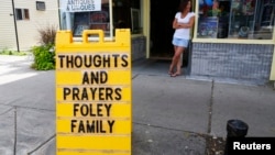 A sign outside a shop remembers James Foley in his hometown of Rochester, New Hampshire, Aug. 20, 2014.