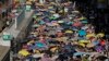 Thousands of protesters raise umbrellas during a rally to support young activists Joshua Wong, Nathan Law and Alex Chow in downtown Hong Kong, Aug. 20, 2017.