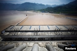 FILE - A view from the Three Gorges dam over the Yangtze River in Yichang, Hubei province August 9, 2012. The environmental problems associated with the Three Gorges dam illustrate China's energy dilemma: To move away from its reliance on coal-fired power plants, Beijing says it has to develop cleaner forms of power.