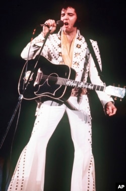 FILE - A 1973 photo shows Elvis Presley in concert.