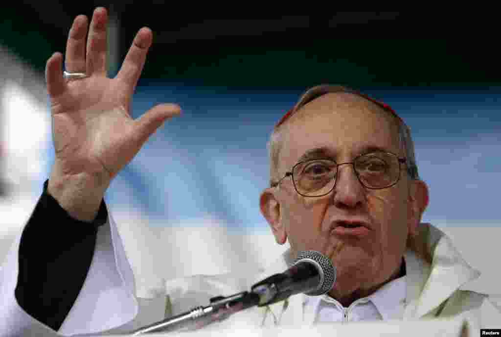 Then Archbishop of Buenos Aires Cardinal Jorge Bergoglio leads a mass during the annual gathering and pilgrimage to the church dedicated to Saint Cajetan, the patron saint of labor and bread, in Buenos Aires, August 7, 2009.