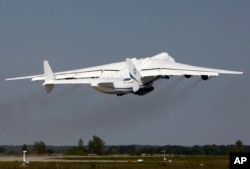 The world's largest airplane, Ukrainian Antonov An-225 Mriya takes off at the airport near Hostomel near Kiev , Ukraine, Tuesday, May 10, 2016.