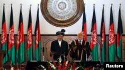 FILE - Ashraf Ghani Ahmadzai takes the oath during his inauguration as president in Kabul, Sept. 29, 2014. Ghani governed the country through a 'highly selective, narrow circle of loyalists,' destabilizing the government at a critical juncture, according to a SIGAR report.