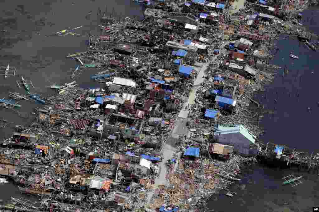 An aerial image taken from a Philippine Air Force helicopter shows the devastation of the first landfall by typhoon Haiyan in Guiuan, Eastern Samar province, central Philippines, Nov. 11, 2013. 