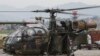 هلیکوپتر نظامی نپال، پس از یافتن لاشه هلیکوپتر مفقود شده ارتش آمریکا، برای ارائه گزارش در کاتماندو فرود آمد - ۲۵ اردیبهشت ۱۳۹۴ 