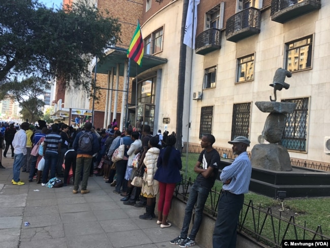 Bank queues For close to three years now, Zimbabweans spend hours to days in bank queues as cash shortages persist Harare, Sept. 10, 2018.