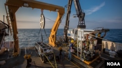 The remotely operated vehicles, Seirios and Deep Discoverer, are seen aboard NOAA's Okeanos ship. 